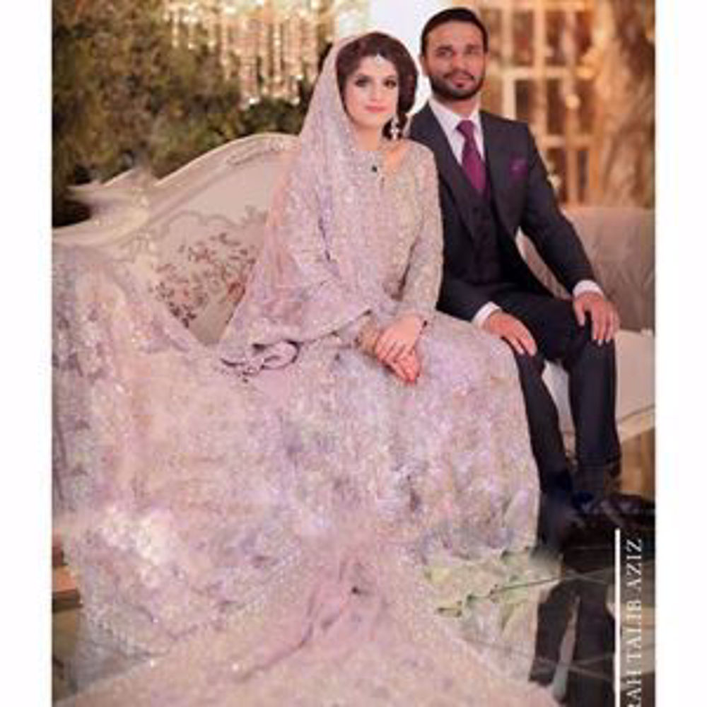 Picture of Kulsoom, a breathtaking bride on her wedding day in a lavender Farah Talib Aziz signature bridal