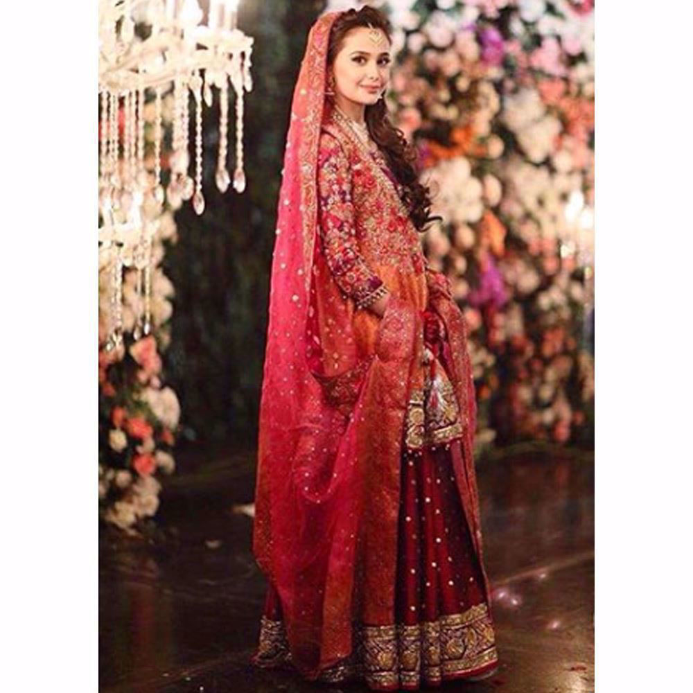 Picture of Absolutely gorgeous in a kalidaar Farah Talib Aziz angarkha in regal shades of burnt orange and magenta pink