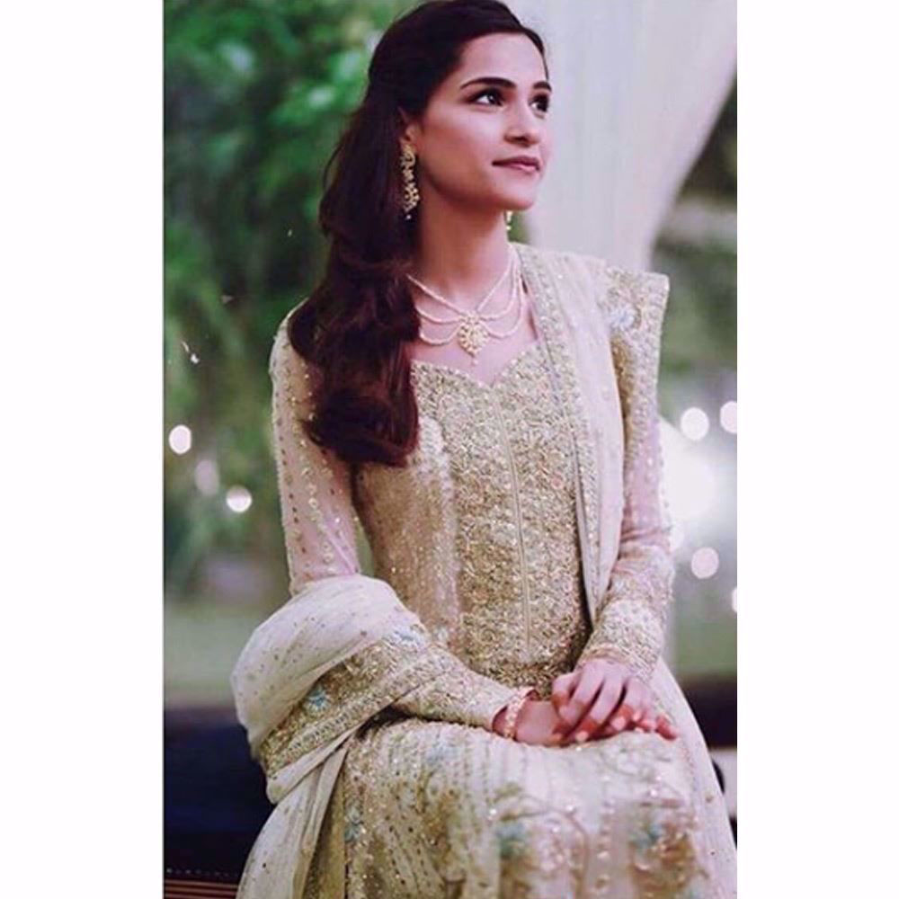 Picture of Neha Patel, absolutely gorgeous on her Nikkah in a custom made Farah Talib Aziz kalidaar peshwas in Ivory featuring gold embellishments