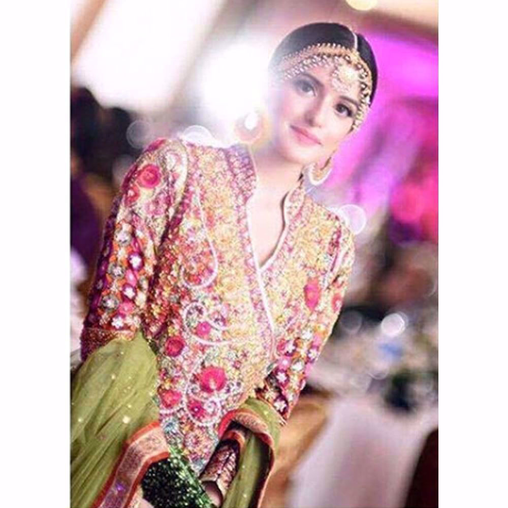 Picture of We love how gorgeous Anna looks in a classic Farah Talib Aziz angarkha in festive shades of pinks