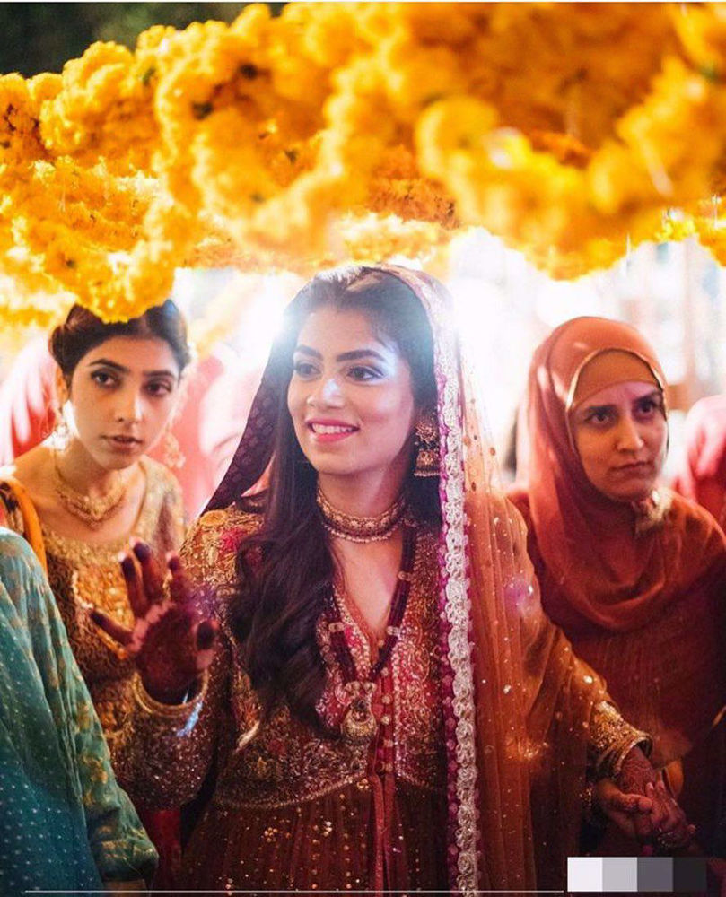 Picture of Farah Talib Aziz gives us a lesson in glamour. The bride wears a signature #FarahTalibAziz kalidaar in the perfectly festive colours