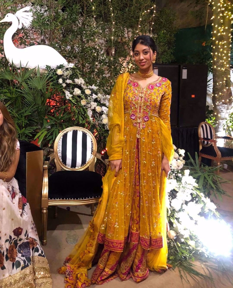 Picture of Toronto based influencer Sofia explores karachi weddings at #chinbad, in a stunning saffron kalidaar accentuated with magenta and gold details