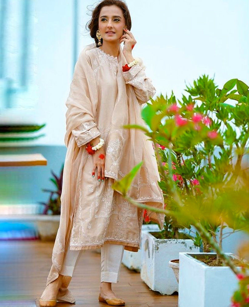 Picture of Perfecting the traditional Eid look, #MomalSheikh celebrates in our intricately embroidered Beige Emma Kurta Shalwar.