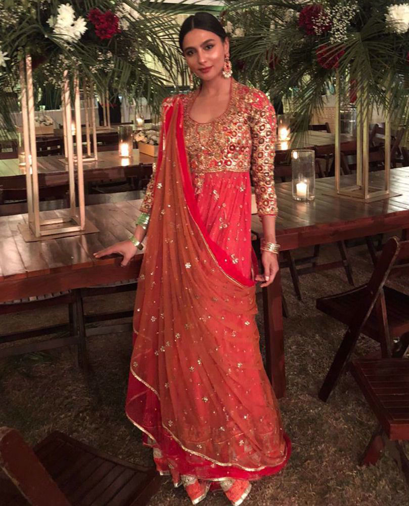 Picture of #YasmeenHashmi uber festive in one of the latest #FarahTalibAziz favourites. Featured here, is a gorgeous candy pink kalidaar with burnt orange, magenta and gold accents