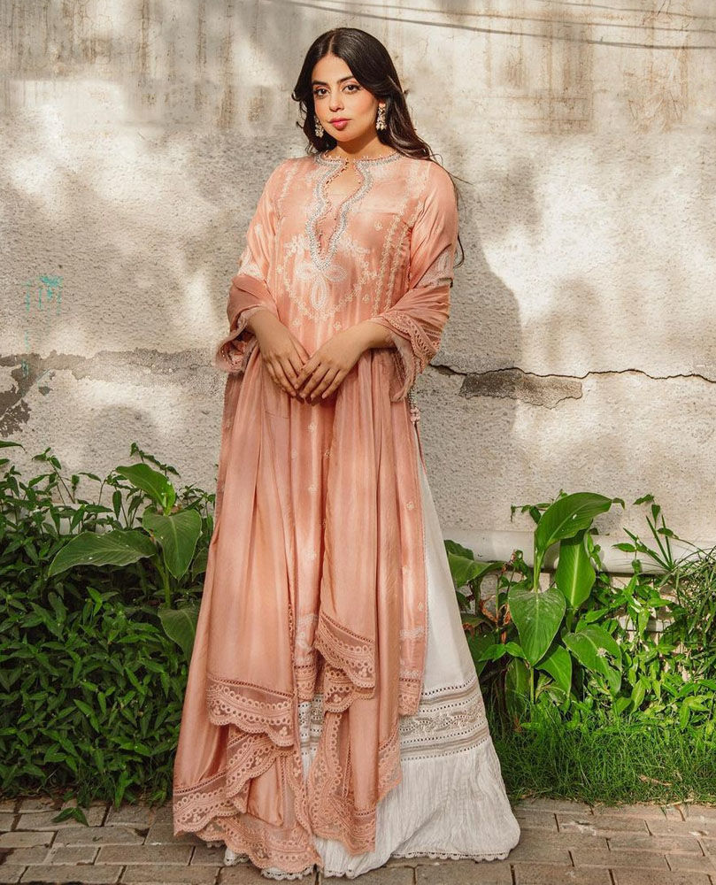 Picture of Yashma Gill celebrating Eid in our Erica Apricot outfit thatΓÇÖs the perfect blend of traditional technique on a modern silhouette
